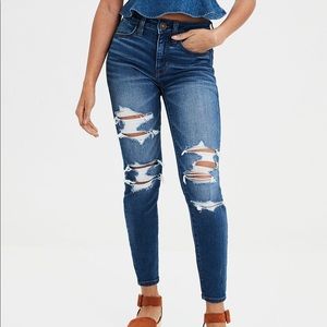 high rise distressed blue jeans